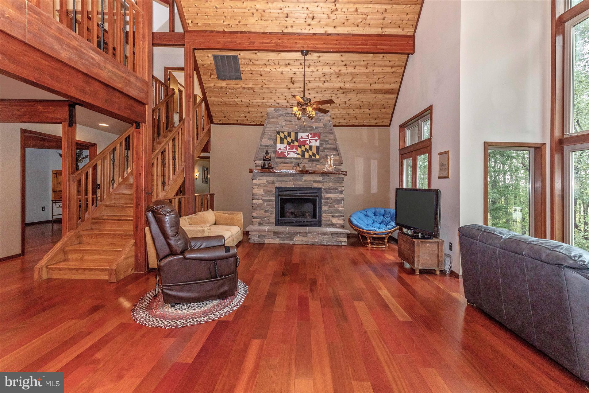 914 Trevanion Road Union Bridge, MD 21791 - Photo 21 of 54 Stone gas fireplace with live edge walnut mantle.