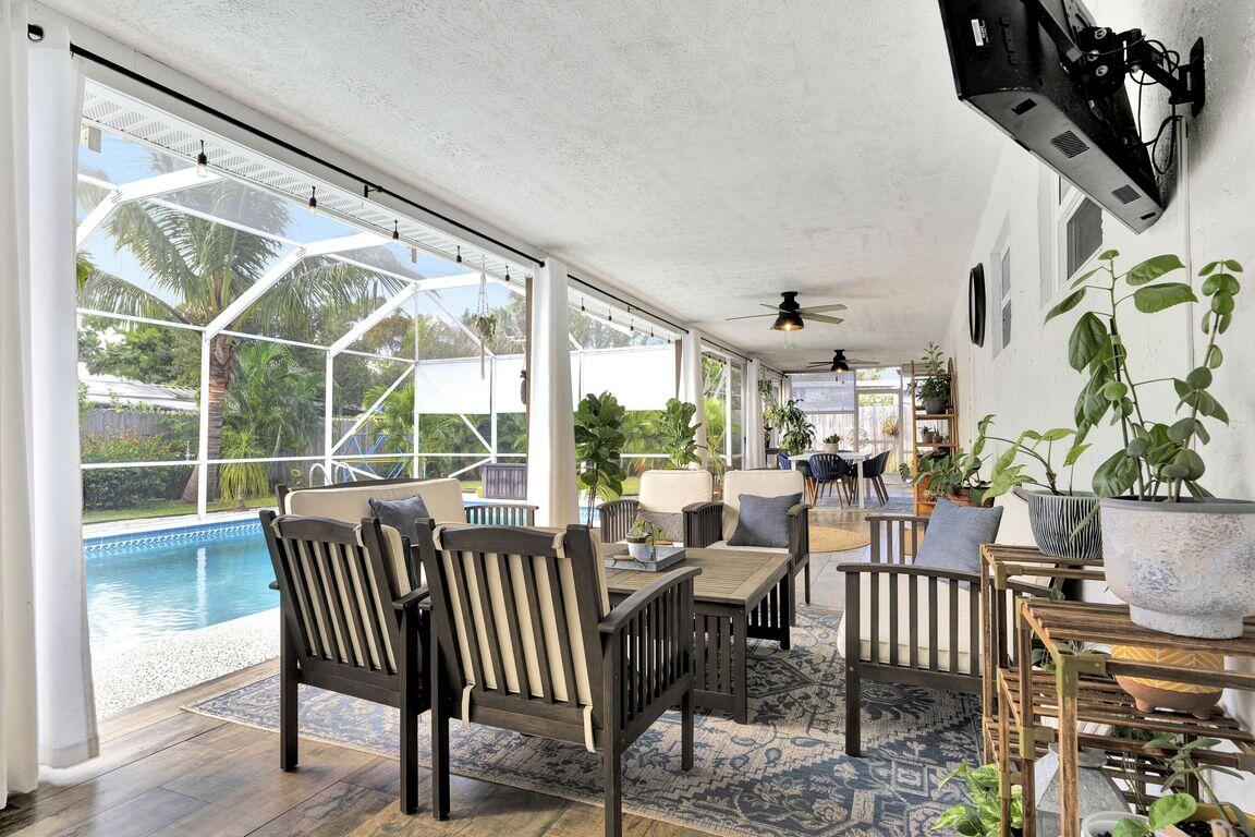 1104 Northwest 12th Terrace Stuart, FL 34994 - Photo 24 of 32 a view of a dining room with furniture window and outside view