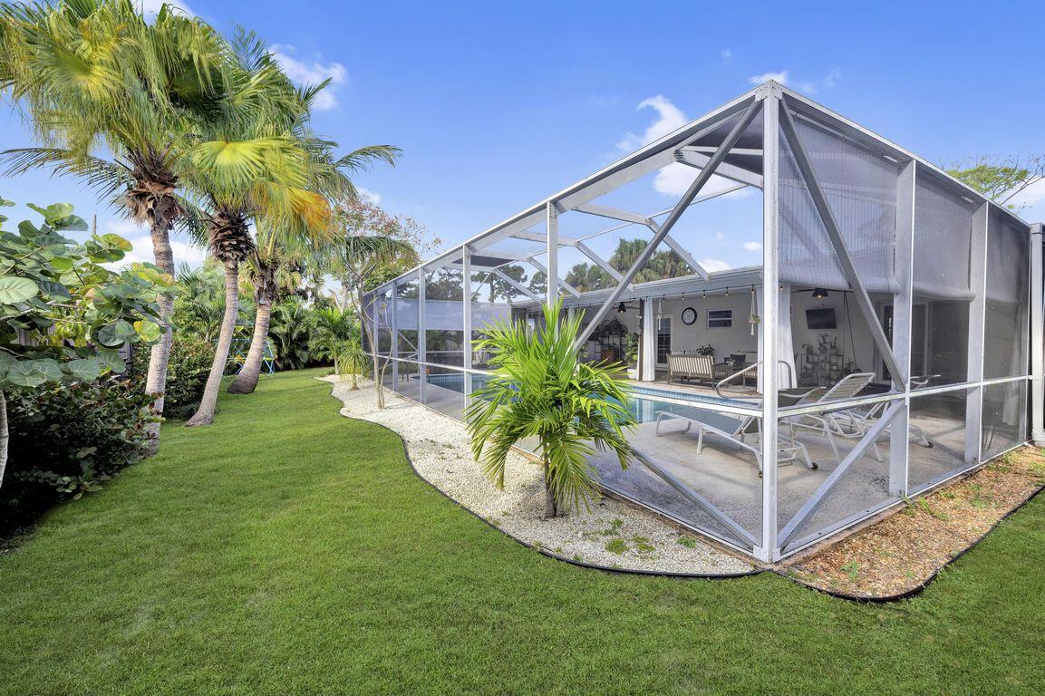 1104 Northwest 12th Terrace Stuart, FL 34994 - Photo 26 of 32 a view of a house with a yard