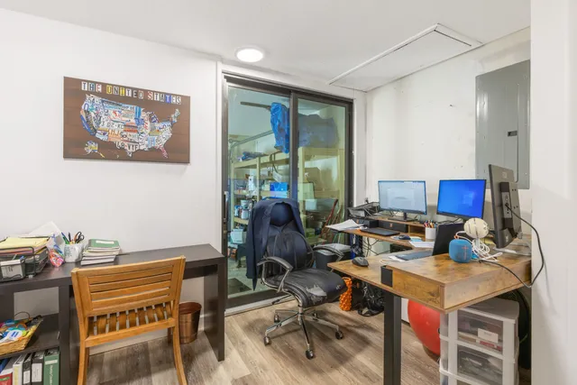 a view of a workspace with furniture