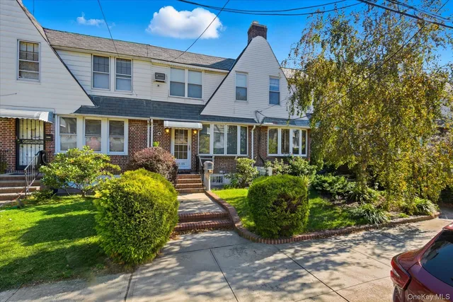 a front view of a house with garden