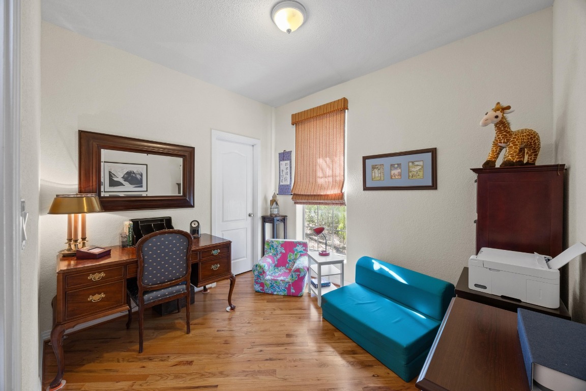 515 Coventry Road Spicewood, TX 78669 - Photo 24 of 36 a living room with furniture and a window