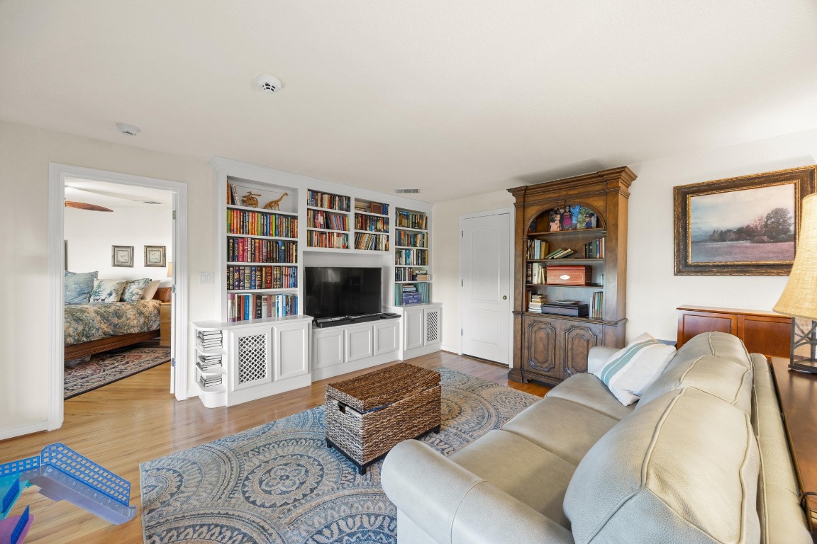 515 Coventry Road Spicewood, TX 78669 - Photo 29 of 36 a living room with furniture and a flat screen tv