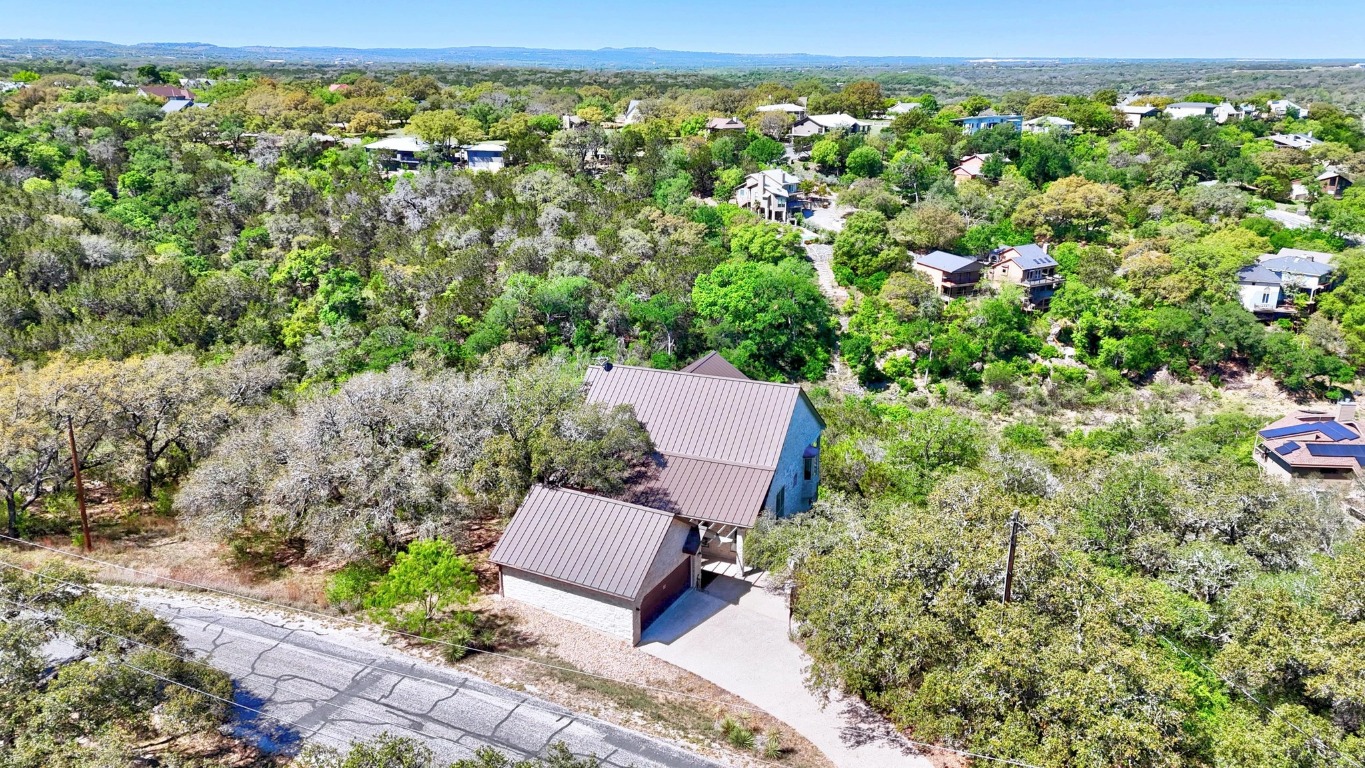 515 Coventry Road Spicewood, TX 78669 - Photo 3 of 36 a view of a yard with an outdoor seating
