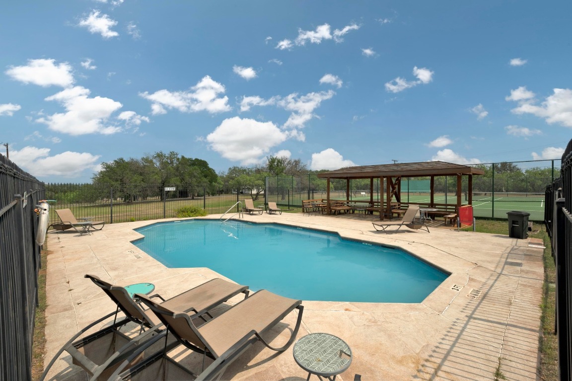 515 Coventry Road Spicewood, TX 78669 - Photo 35 of 36 a view of a house with swimming pool and sitting area
