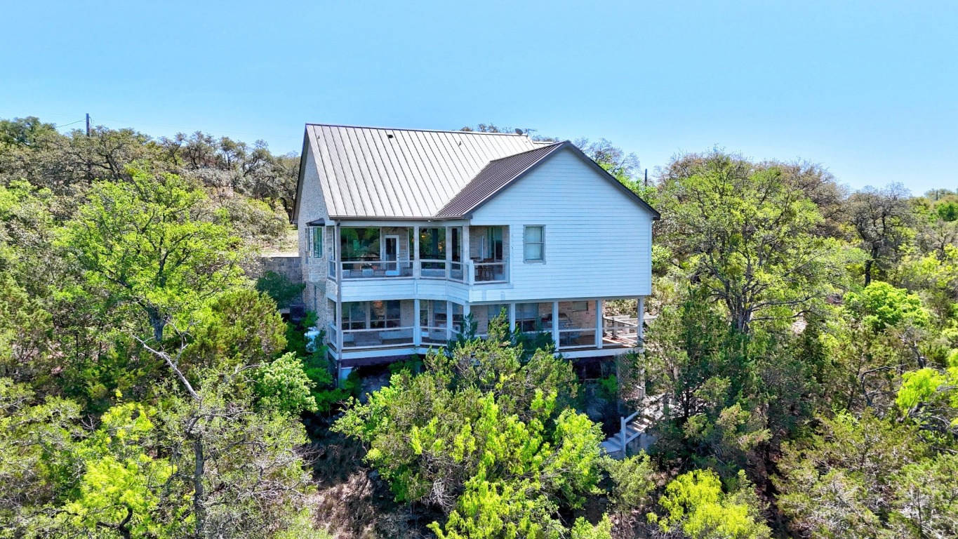 515 Coventry Road Spicewood, TX 78669 - Photo 4 of 36 front view of a house with a small yard