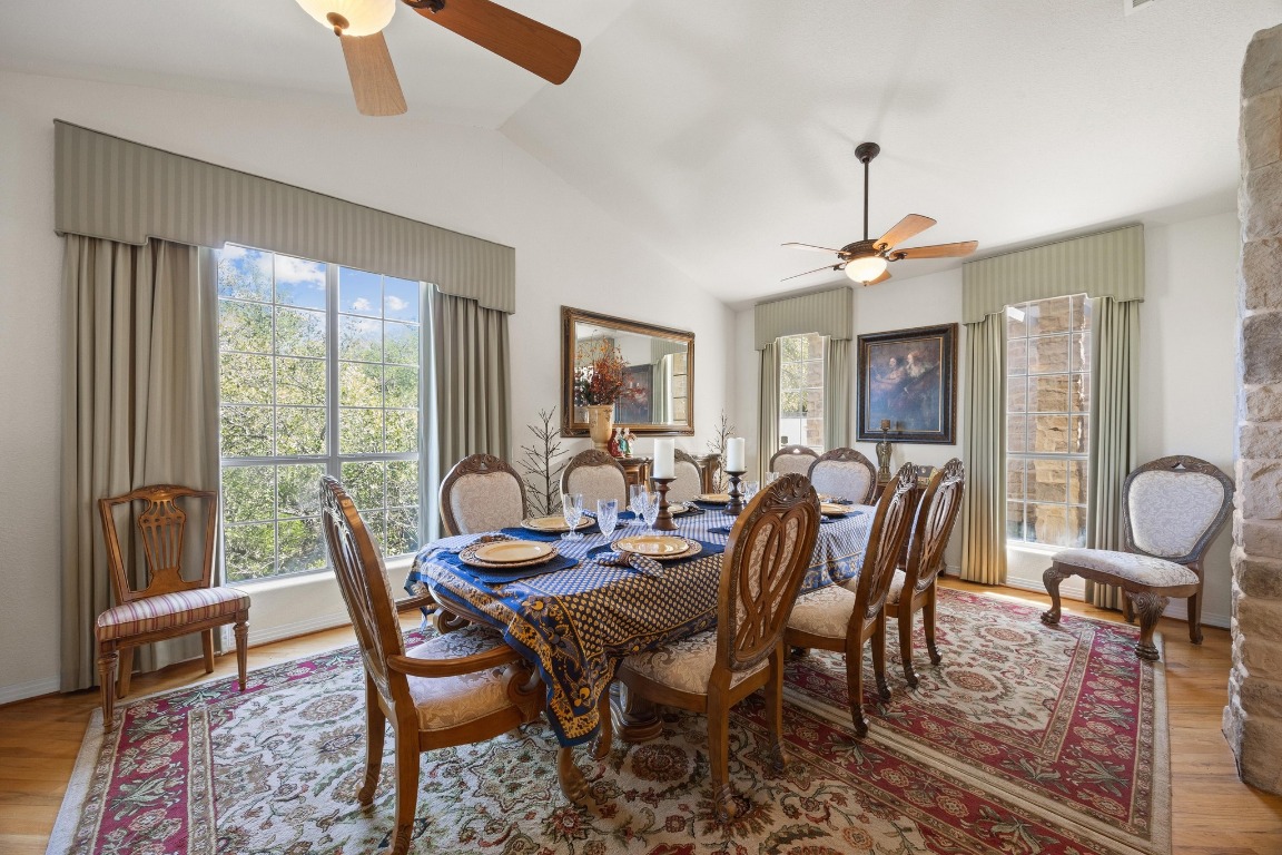 515 Coventry Road Spicewood, TX 78669 - Photo 10 of 36 a view of a dining room with furniture window and wooden floor