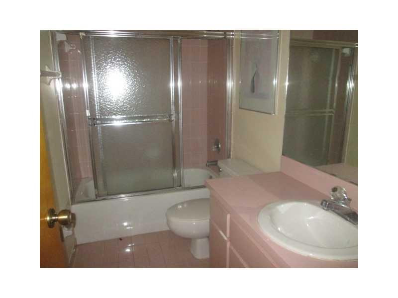 8192 Southwest 90th Avenue Miami, FL 33173 - Photo 11 of 13 a bathroom with a sink toilet and shower