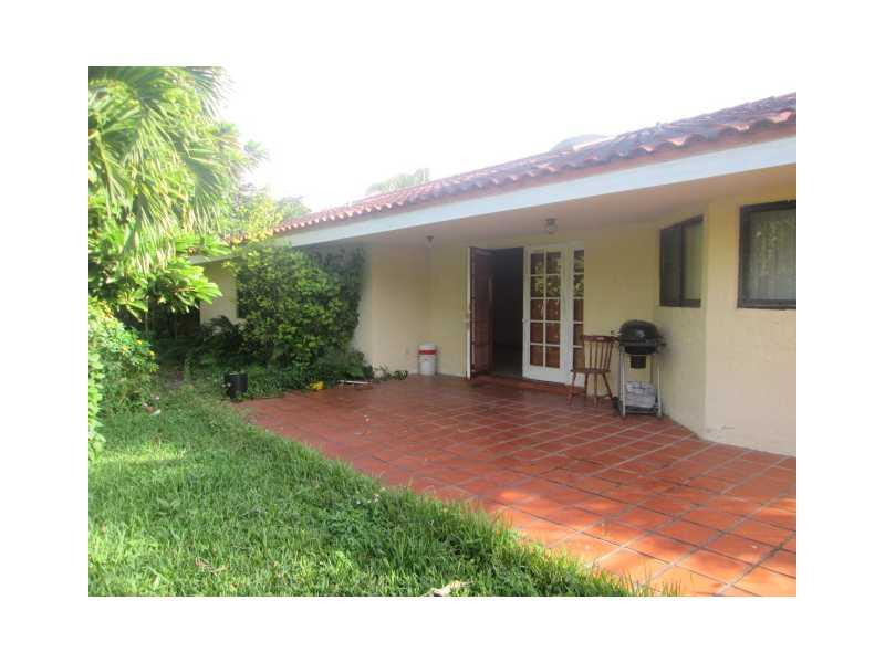 8192 Southwest 90th Avenue Miami, FL 33173 - Photo 13 of 13 a view of an house with backyard porch and garden
