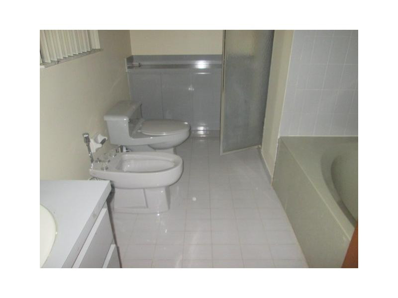 8192 Southwest 90th Avenue Miami, FL 33173 - Photo 9 of 13 a bathroom with a sink and a toilet