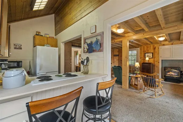 a bedroom with a bed and a table