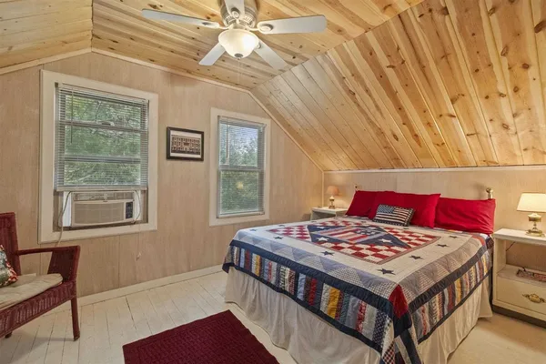 a bathroom with a sink mirror and toilet