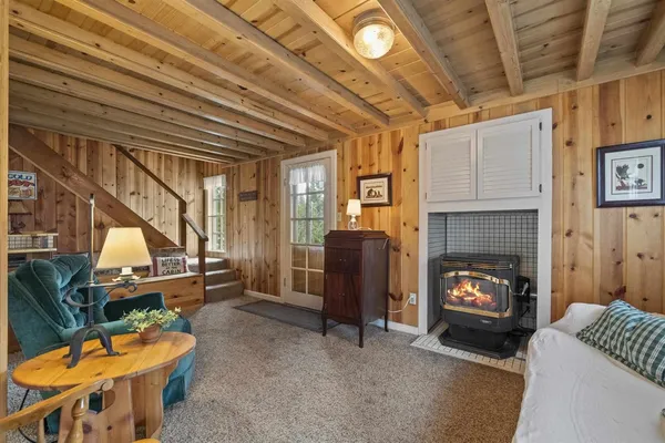 a view of a livingroom with furniture and windows