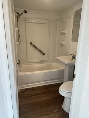 a bathroom with a toilet a sink and a bathtub
