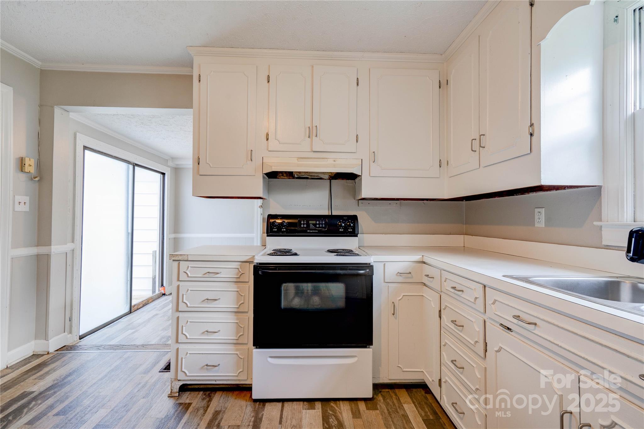 1414 South Post Road Shelby, NC 28152 - Photo 11 of 24 a kitchen with granite countertop white cabinets and white appliances