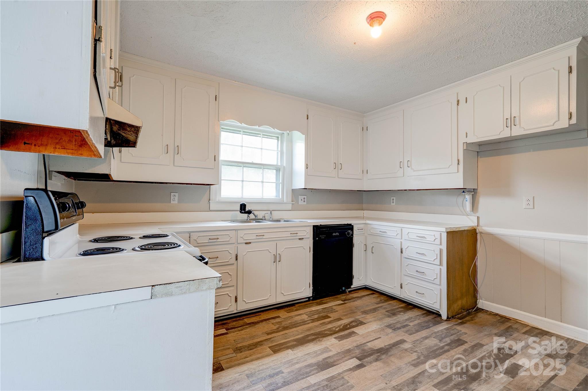 1414 South Post Road Shelby, NC 28152 - Photo 13 of 24 a kitchen with a white cabinets and white appliances