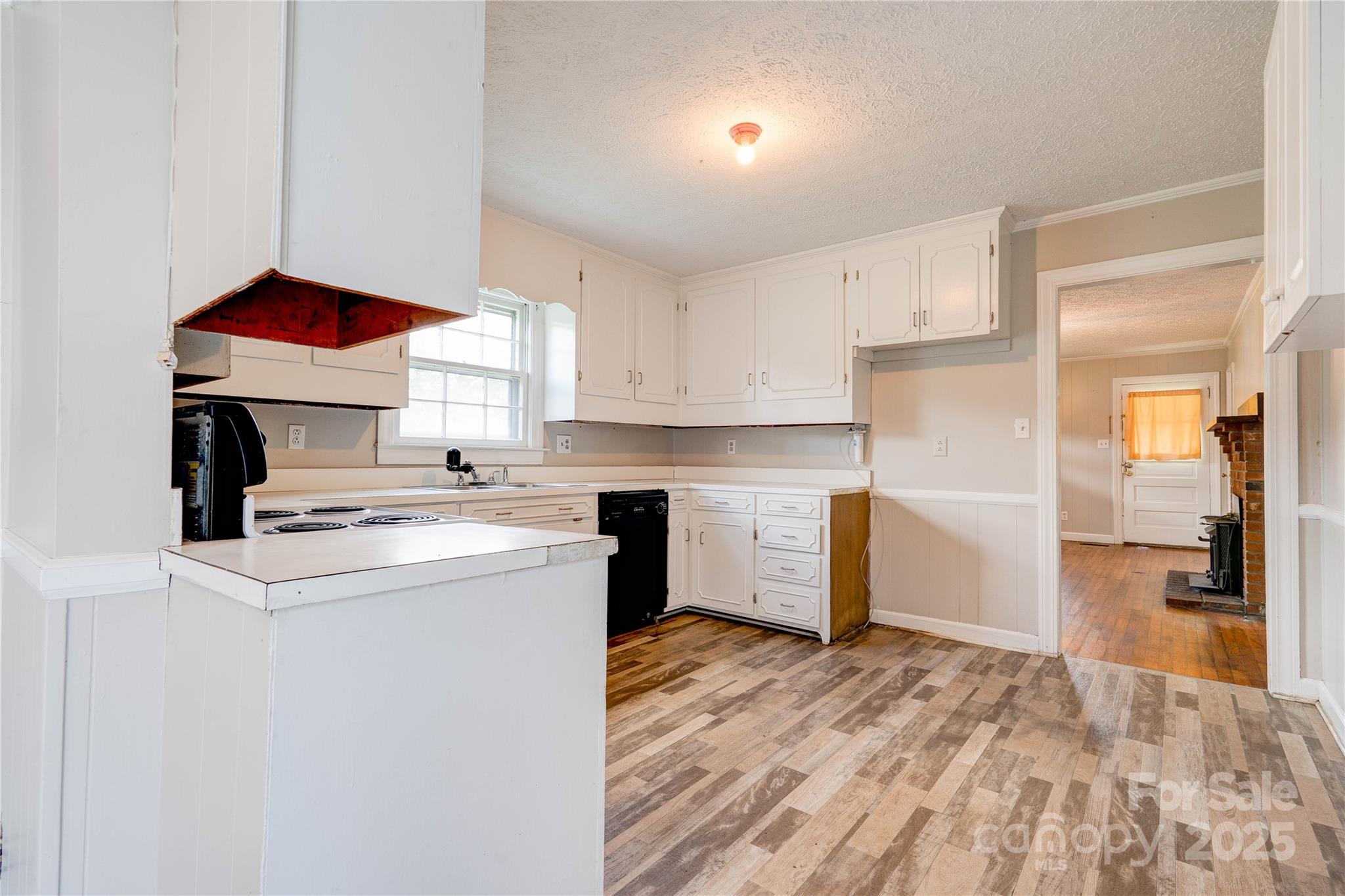 1414 South Post Road Shelby, NC 28152 - Photo 14 of 24 a kitchen with a stove a sink and a refrigerator