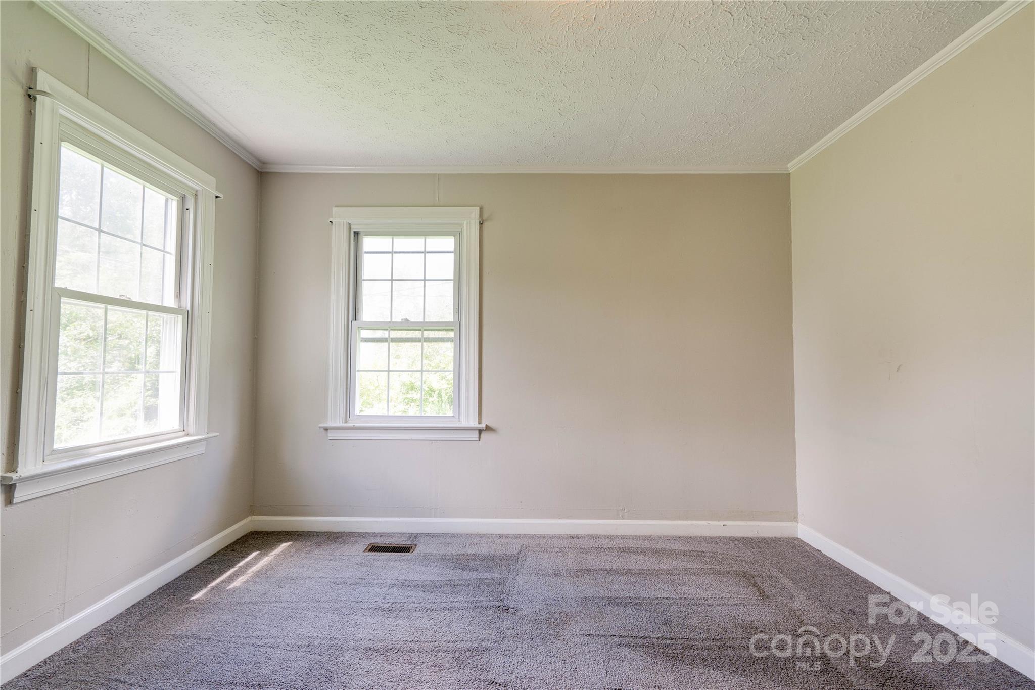 1414 South Post Road Shelby, NC 28152 - Photo 19 of 24 an empty room with windows