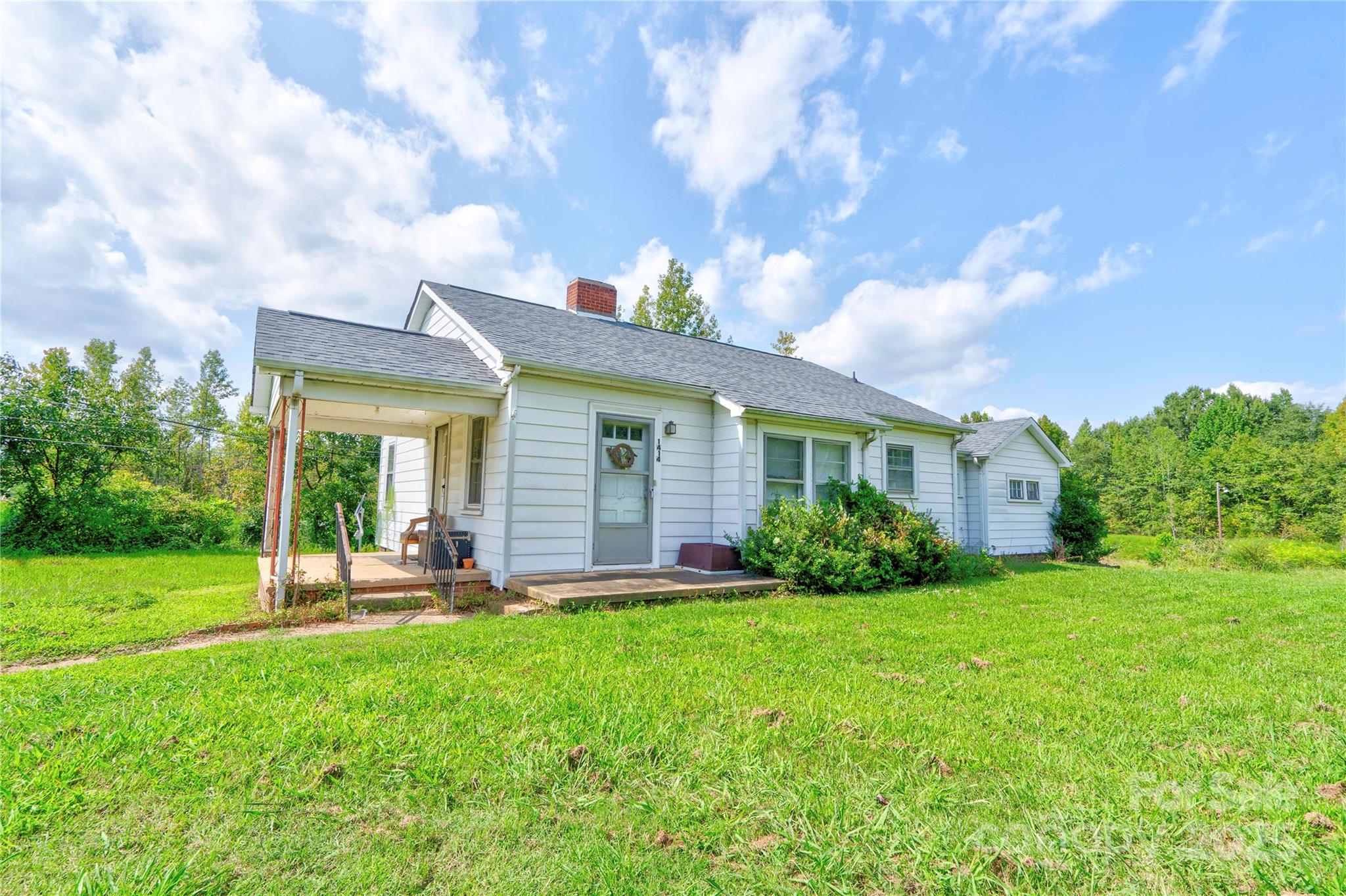 1414 South Post Road Shelby, NC 28152 - Photo 2 of 24 a view of a house with a yard and plants