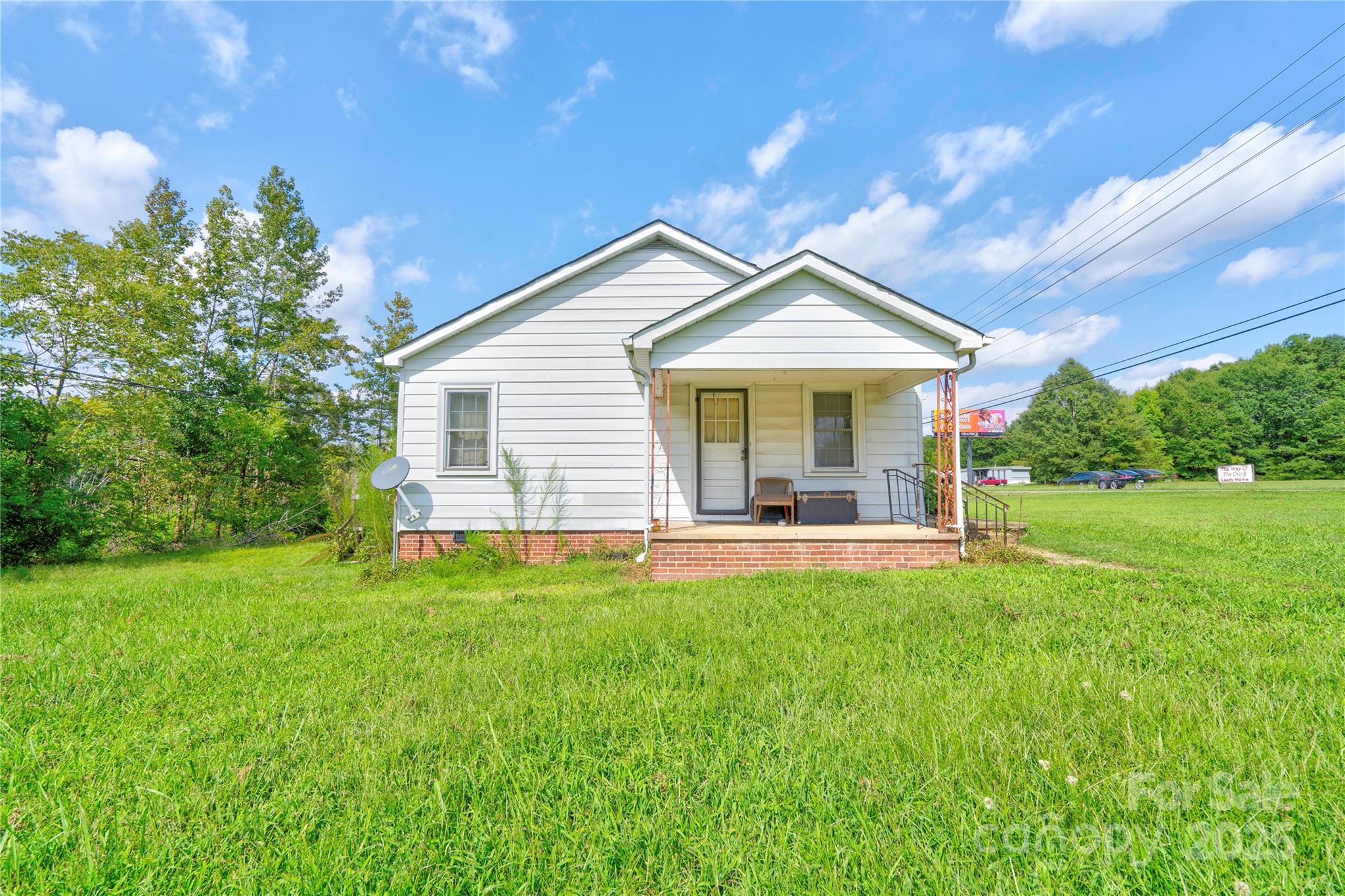 1414 South Post Road Shelby, NC 28152 - Photo 3 of 24 a view of a house with a yard porch and sitting area