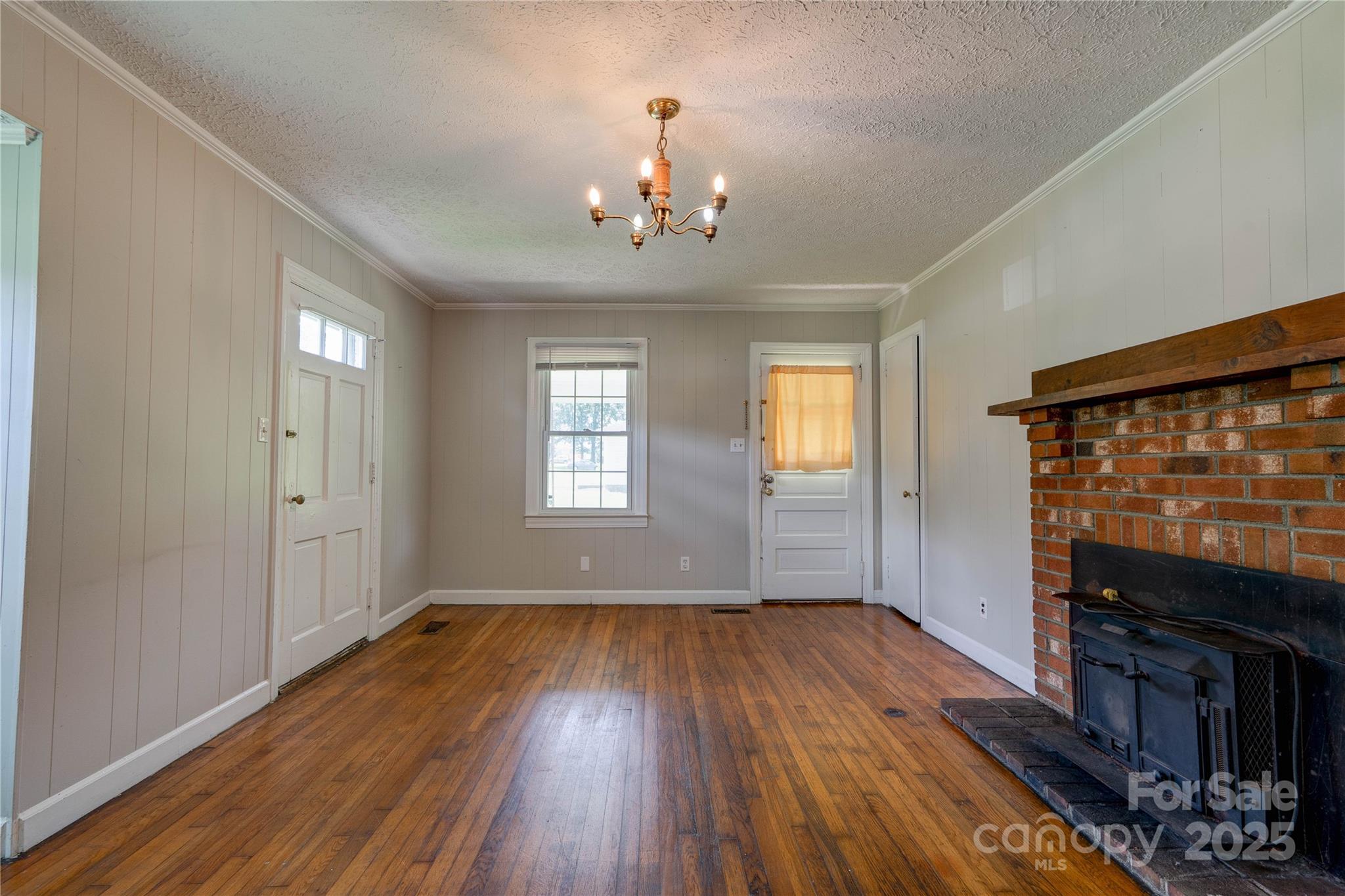1414 South Post Road Shelby, NC 28152 - Photo 9 of 24 wooden floor in an empty room with a window