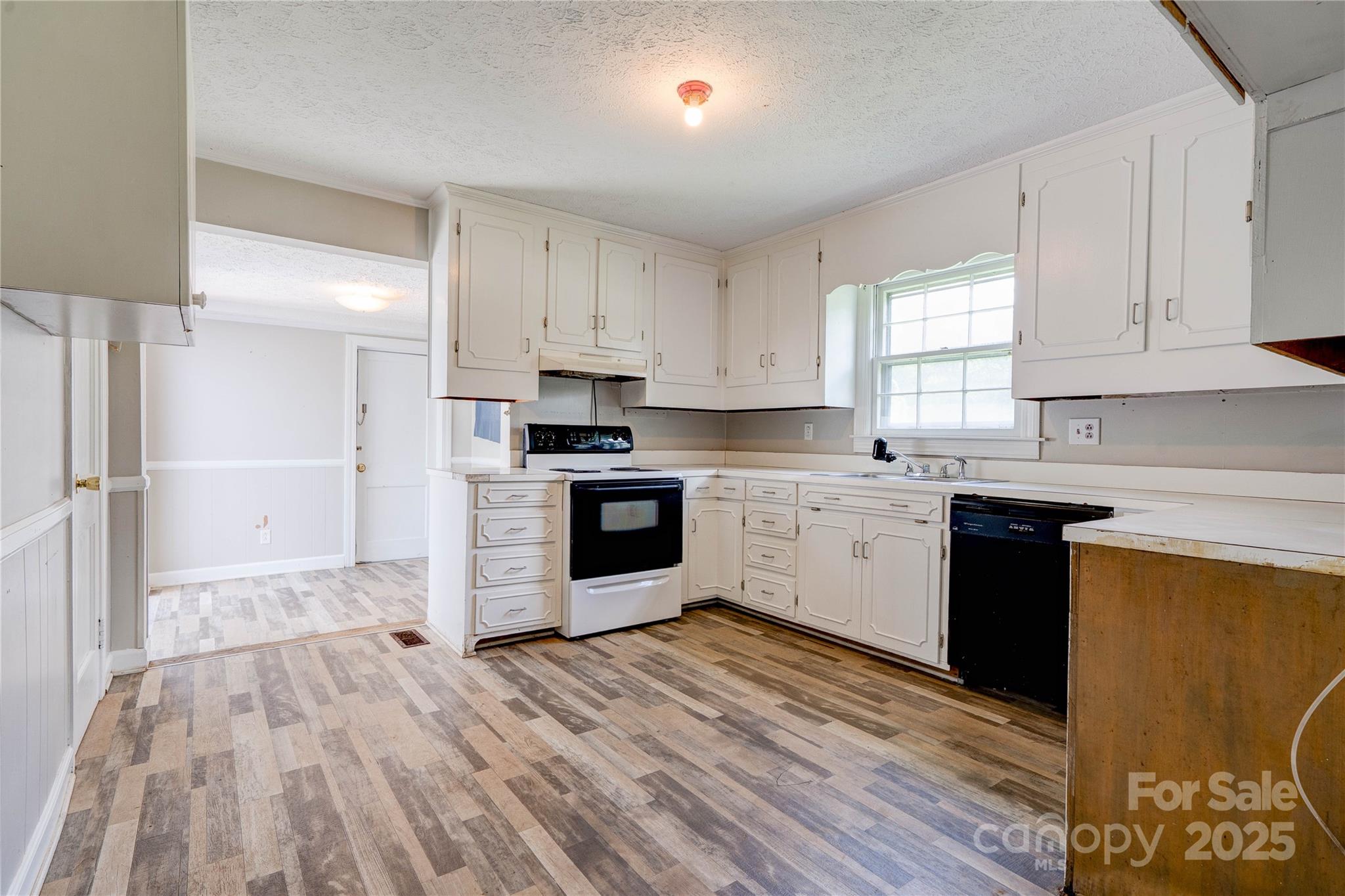 1414 South Post Road Shelby, NC 28152 - Photo 10 of 24 a kitchen with granite countertop a sink cabinets and stainless steel appliances