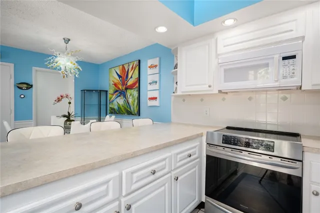 a kitchen with a sink and a stove