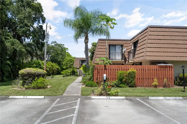 a front view of house with yard and outdoor seating
