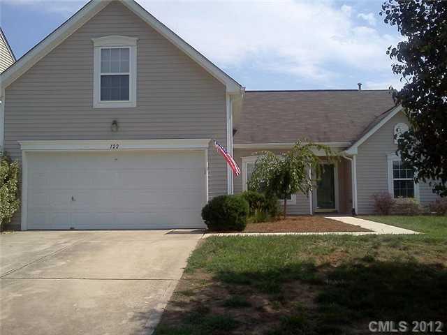 122 Elrosa Road Mooresville, NC 28115 - Photo 1 of 16 a front view of a house with a yard and garage
