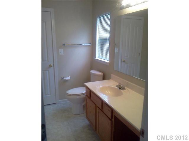122 Elrosa Road Mooresville, NC 28115 - Photo 11 of 16 a bathroom with a sink a toilet and a mirror