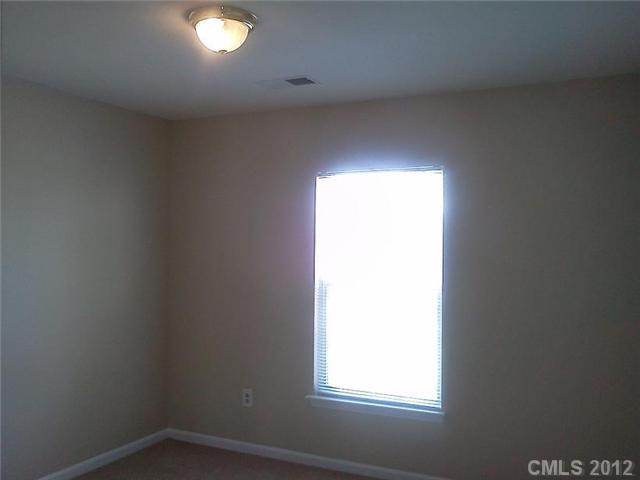 122 Elrosa Road Mooresville, NC 28115 - Photo 13 of 16 an empty room with a window