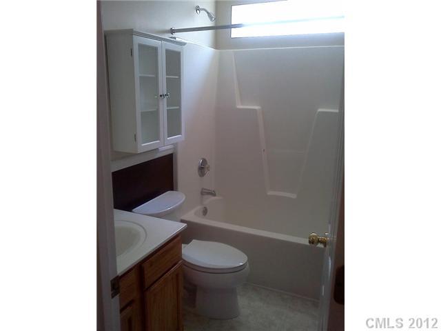 122 Elrosa Road Mooresville, NC 28115 - Photo 15 of 16 a bathroom with a sink a toilet and shower