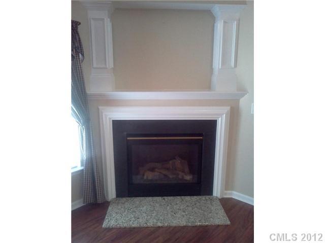 122 Elrosa Road Mooresville, NC 28115 - Photo 5 of 16 a living room with a fireplace