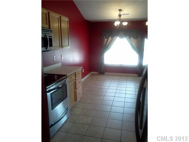 122 Elrosa Road Mooresville, NC 28115 - Photo 7 of 16 a kitchen with a sink and a stove
