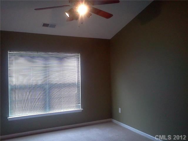 122 Elrosa Road Mooresville, NC 28115 - Photo 10 of 16 a view of an empty room with a window