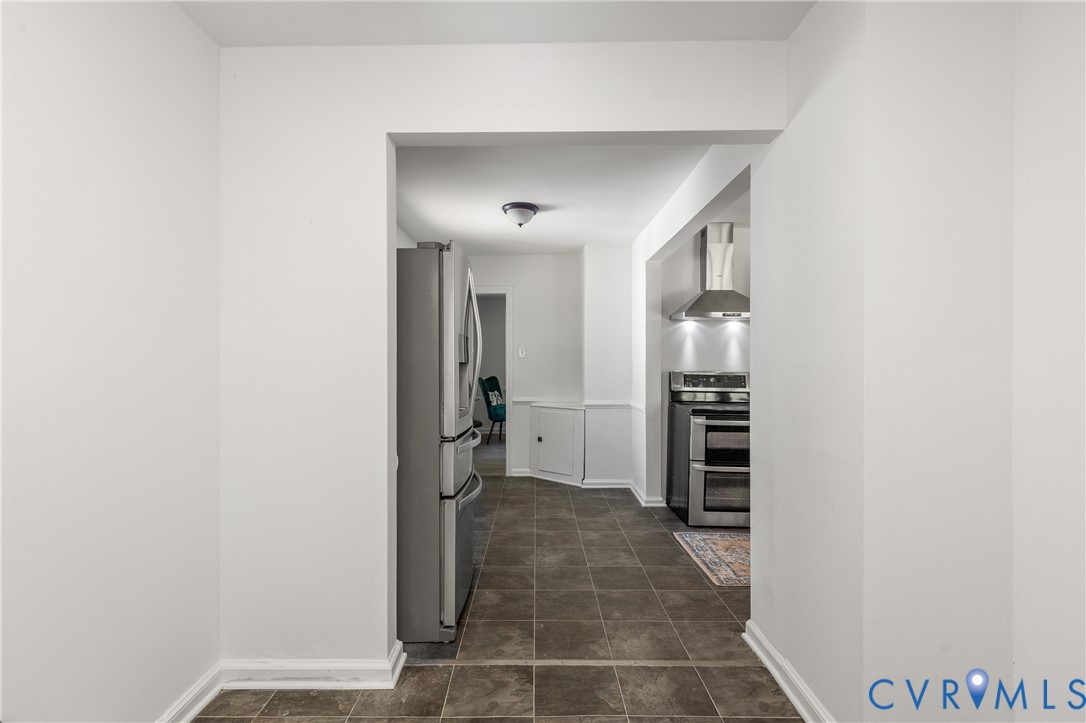 3406 Meadowbridge Road Richmond, VA 23222 - Photo 14 of 41 a view of a hallway with a kitchen