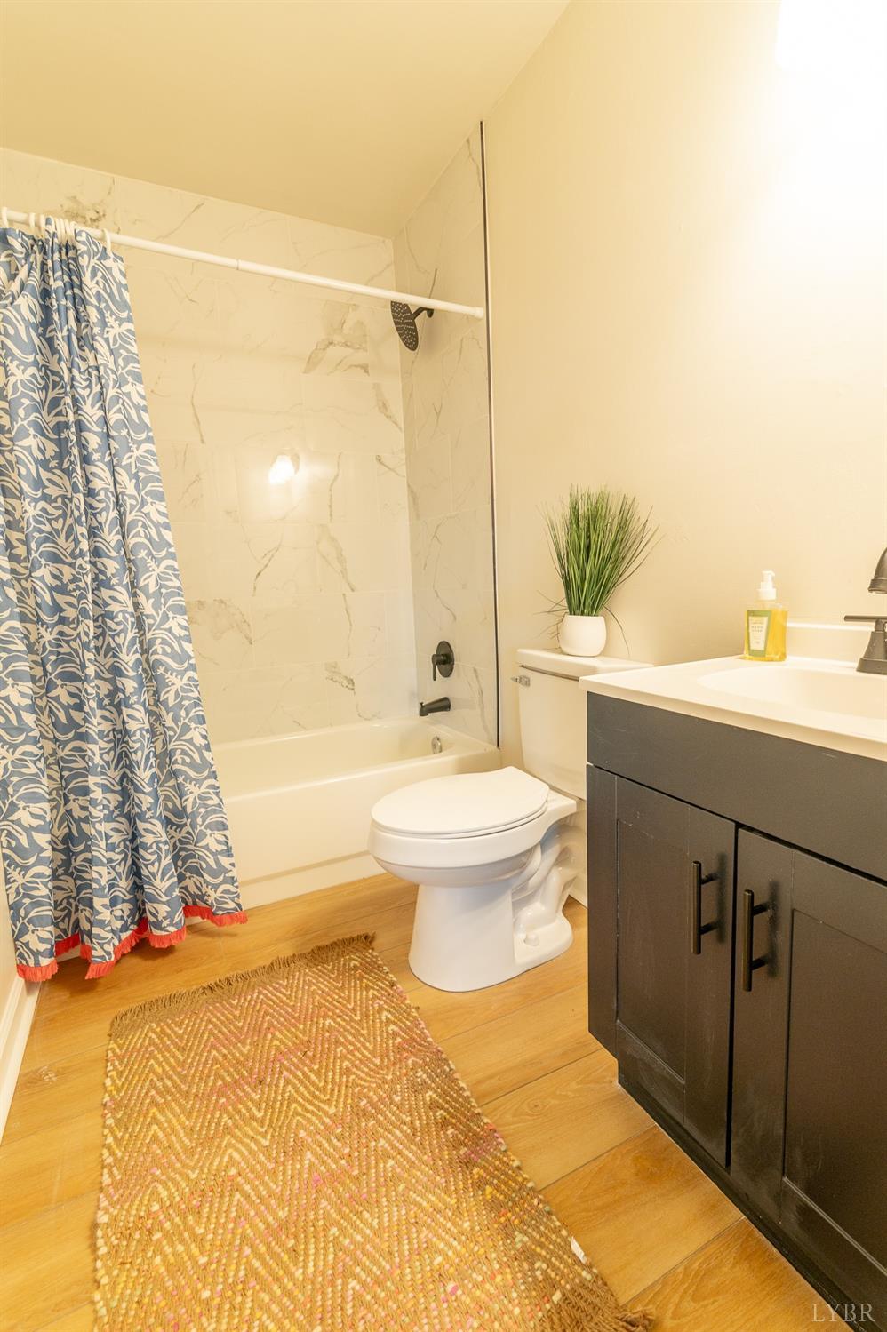 419 Robinson Road Appomattox, VA 24522 - Photo 13 of 19 a bathroom with a sink toilet and shower
