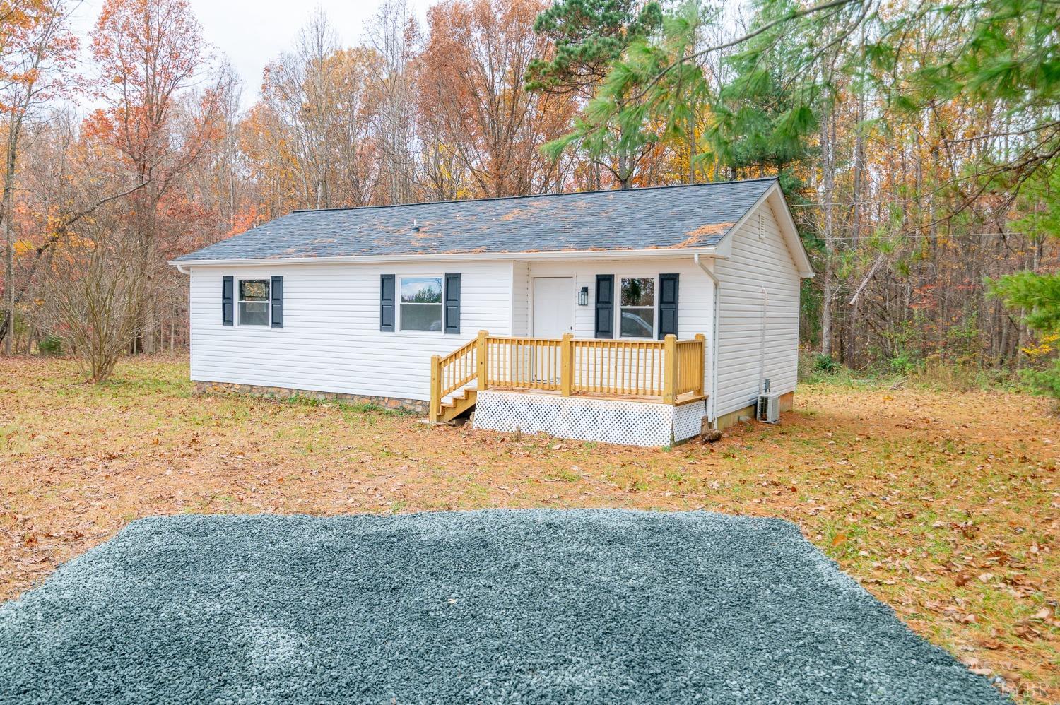 419 Robinson Road Appomattox, VA 24522 - Photo 2 of 19 a view of a house with a yard covered in snow