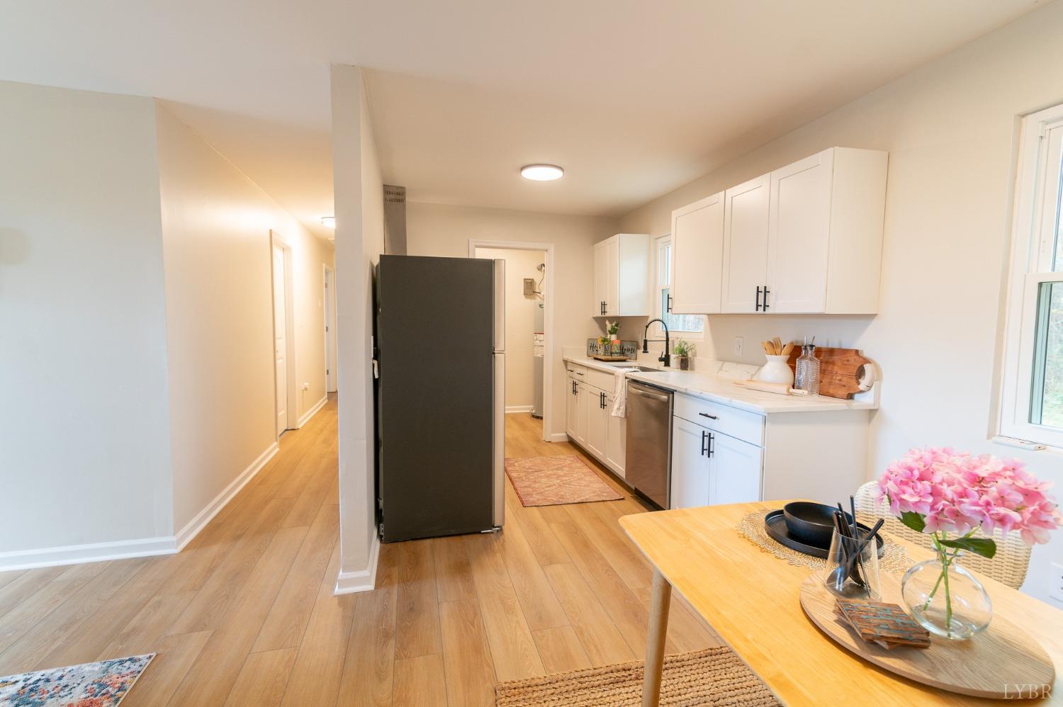 419 Robinson Road Appomattox, VA 24522 - Photo 5 of 19 a kitchen with a refrigerator and microwave
