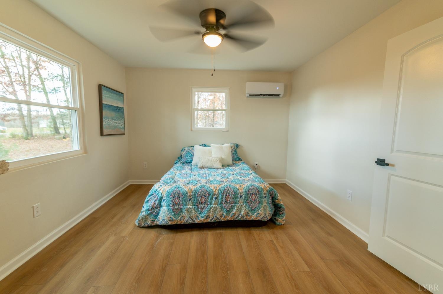 419 Robinson Road Appomattox, VA 24522 - Photo 9 of 19 a bedroom with a bed and window