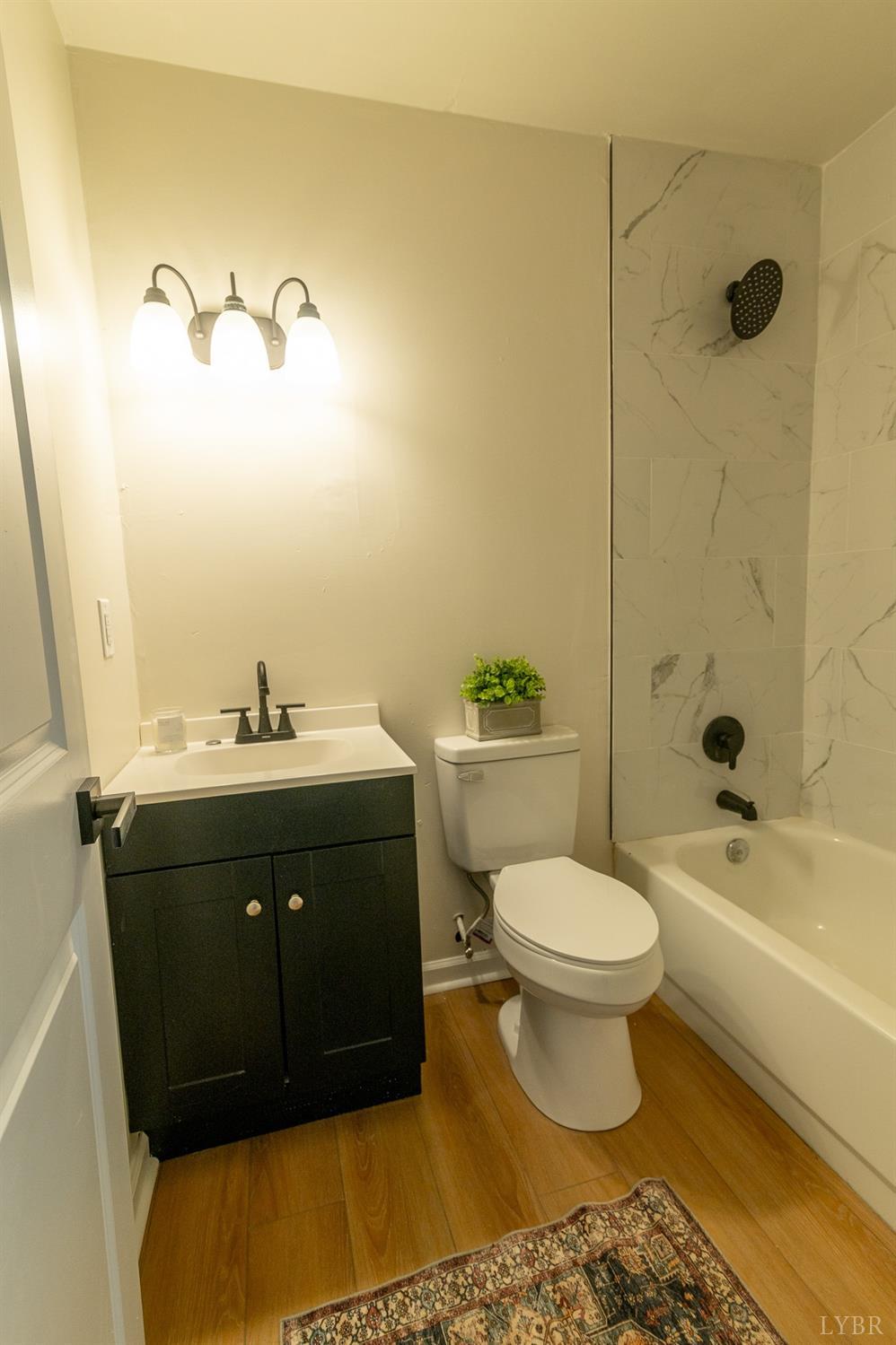 419 Robinson Road Appomattox, VA 24522 - Photo 10 of 19 a bathroom with a sink toilet and shower