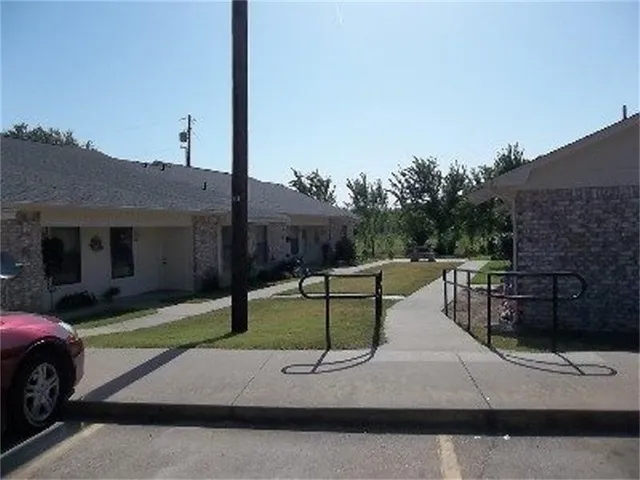 a view of a backyard with couches and a table