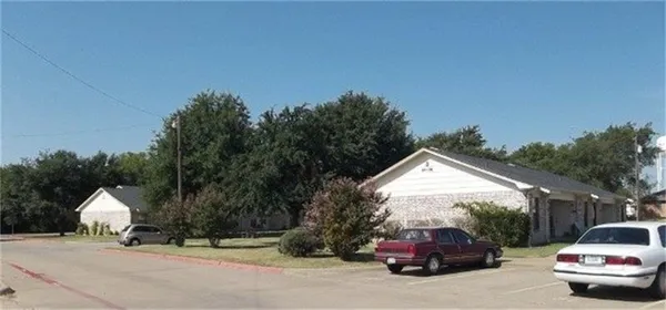 a view of car parked on the side of a road