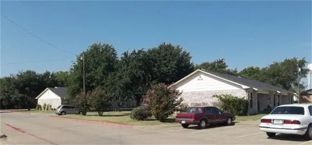 a view of car parked on the side of a road