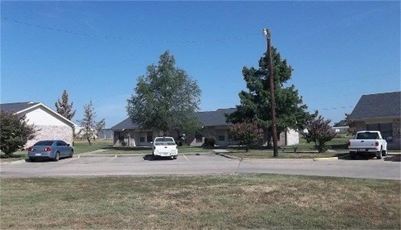 401 Bicentennial Street Bonham, TX 75418 - Photo 3 of 6 a car parked on the side of the road