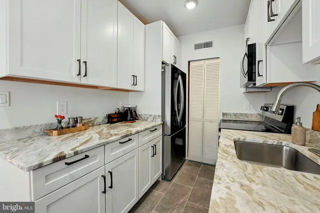 a backyard of a house with outdoor seating