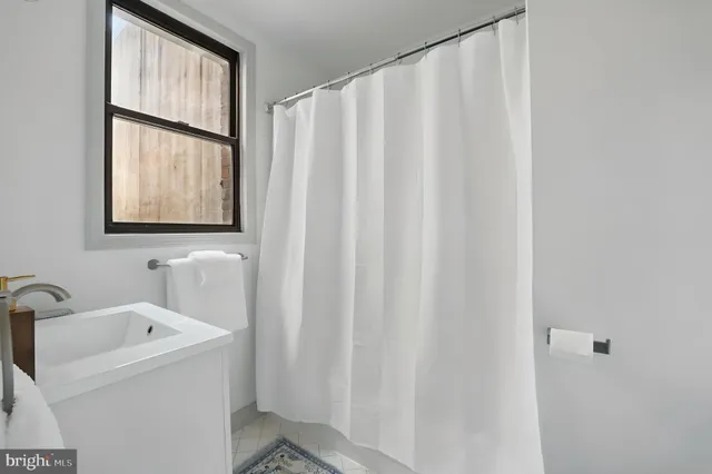 a bed room with a bed and a window