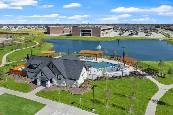 an aerial view of a house with garden space and outdoor seating