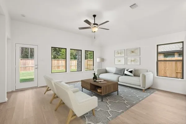 a living room with furniture and a window