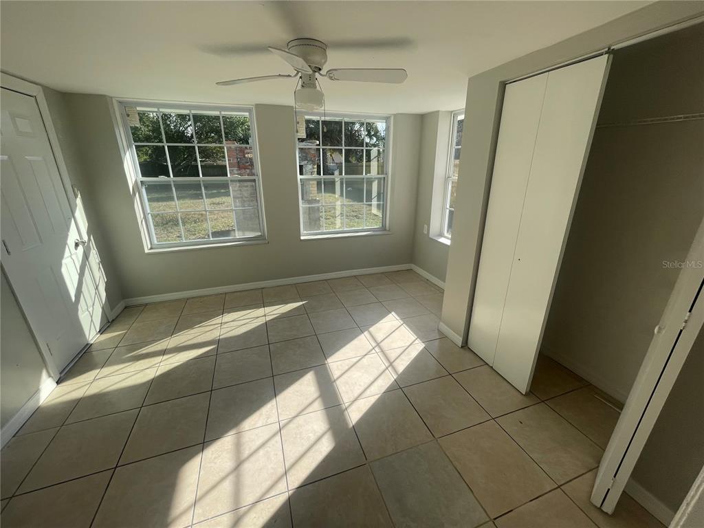 6746 Old Main Street New Port Richey, FL 34653 - Photo 17 of 39 a view of an empty room with windows
